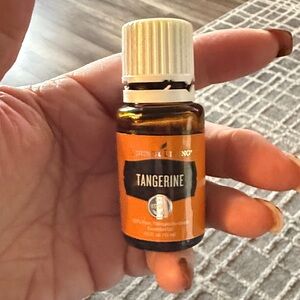 Young Living 100%Tangerine Essential Oil openedpartially used. 3/4of bottle left